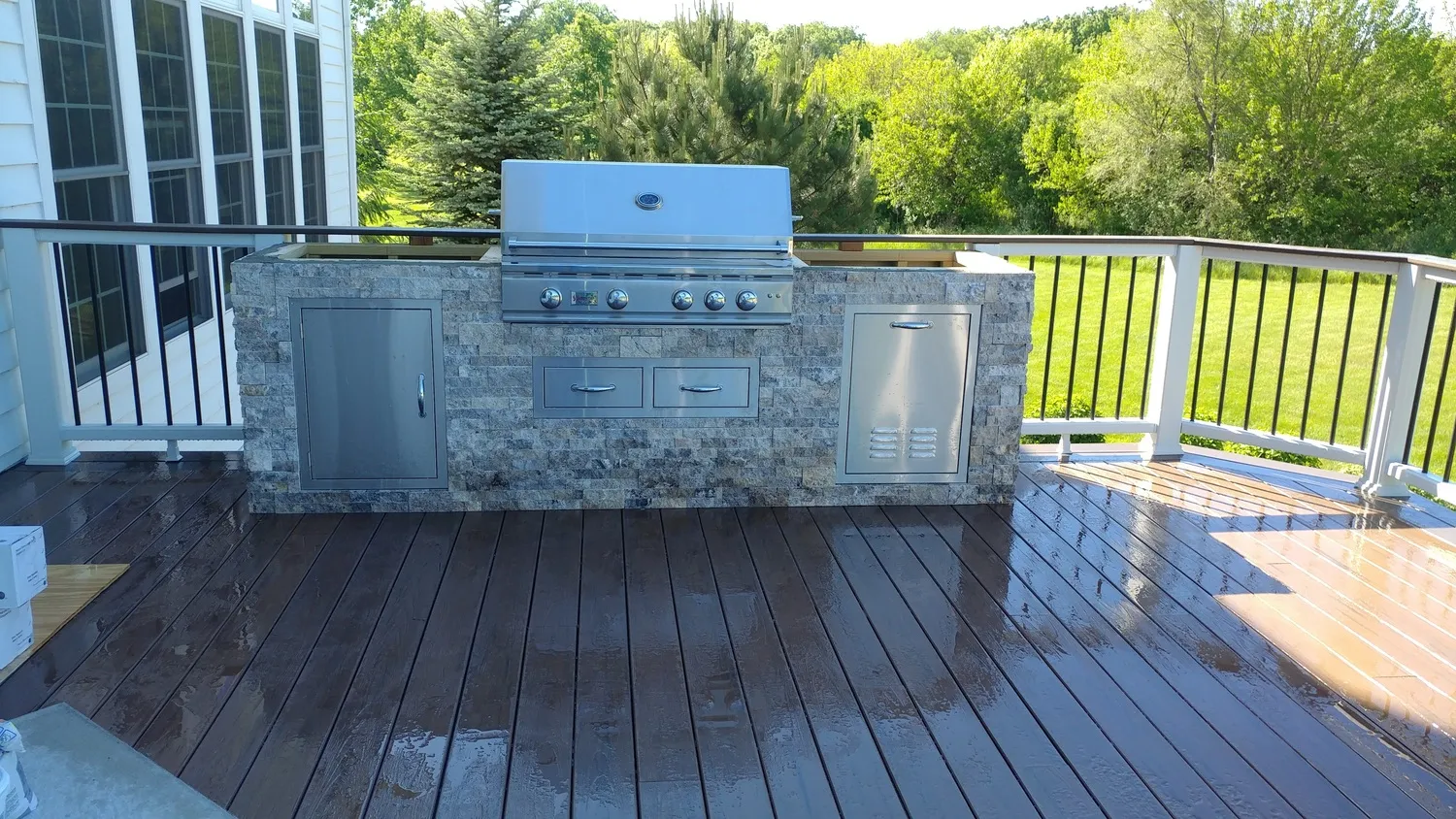 completed outdoor kitchen tile installation with stone tiles