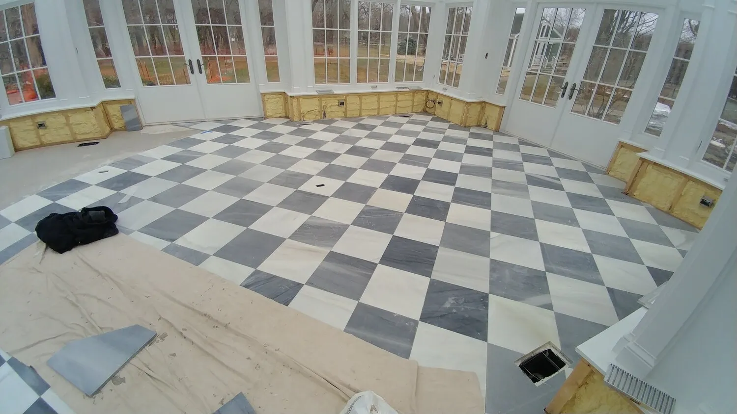 black and white checkered tile installation
